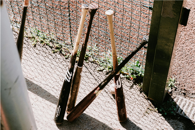 Why does major league baseball use wooden bats